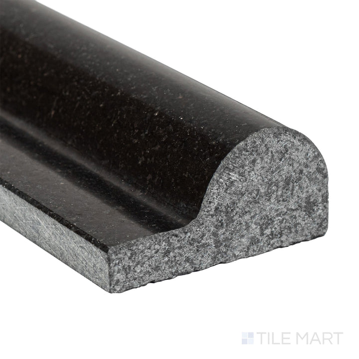 Corner close-up of Absolute Black Granite 2x12 polished classic chair rail showing sleek edge and high-gloss finish.