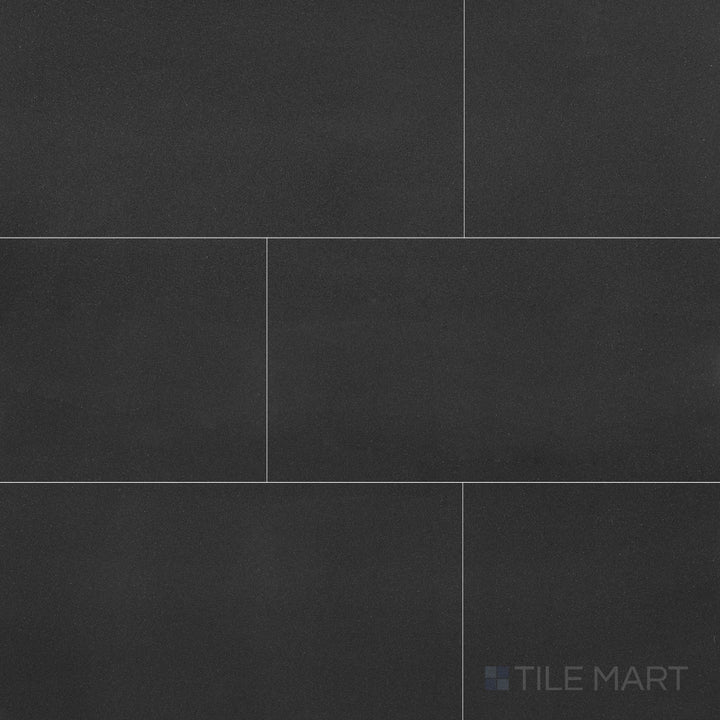 Full view of Basalt Black 12x24 honed tile, showcasing rich volcanic stone texture and smooth surface for modern design aesthetics.