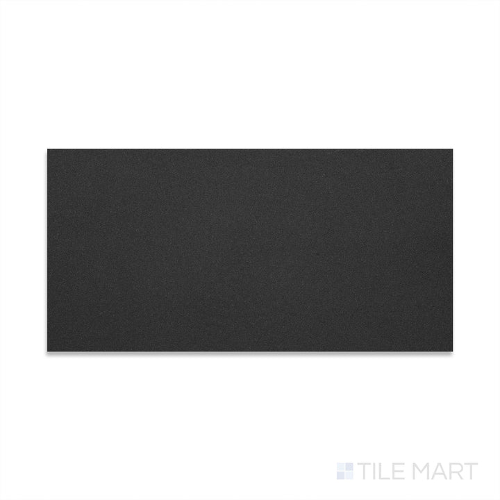 Flat-lay image of Basalt Black 12x24 honed tile, featuring a dark grey to black surface with a velvety matte sheen and minimal visual variation.