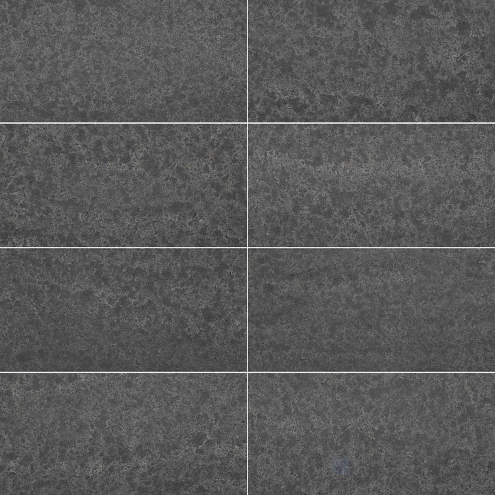 Basalt Black 12x24 tile with a flamed and brushed surface and refined stone texture