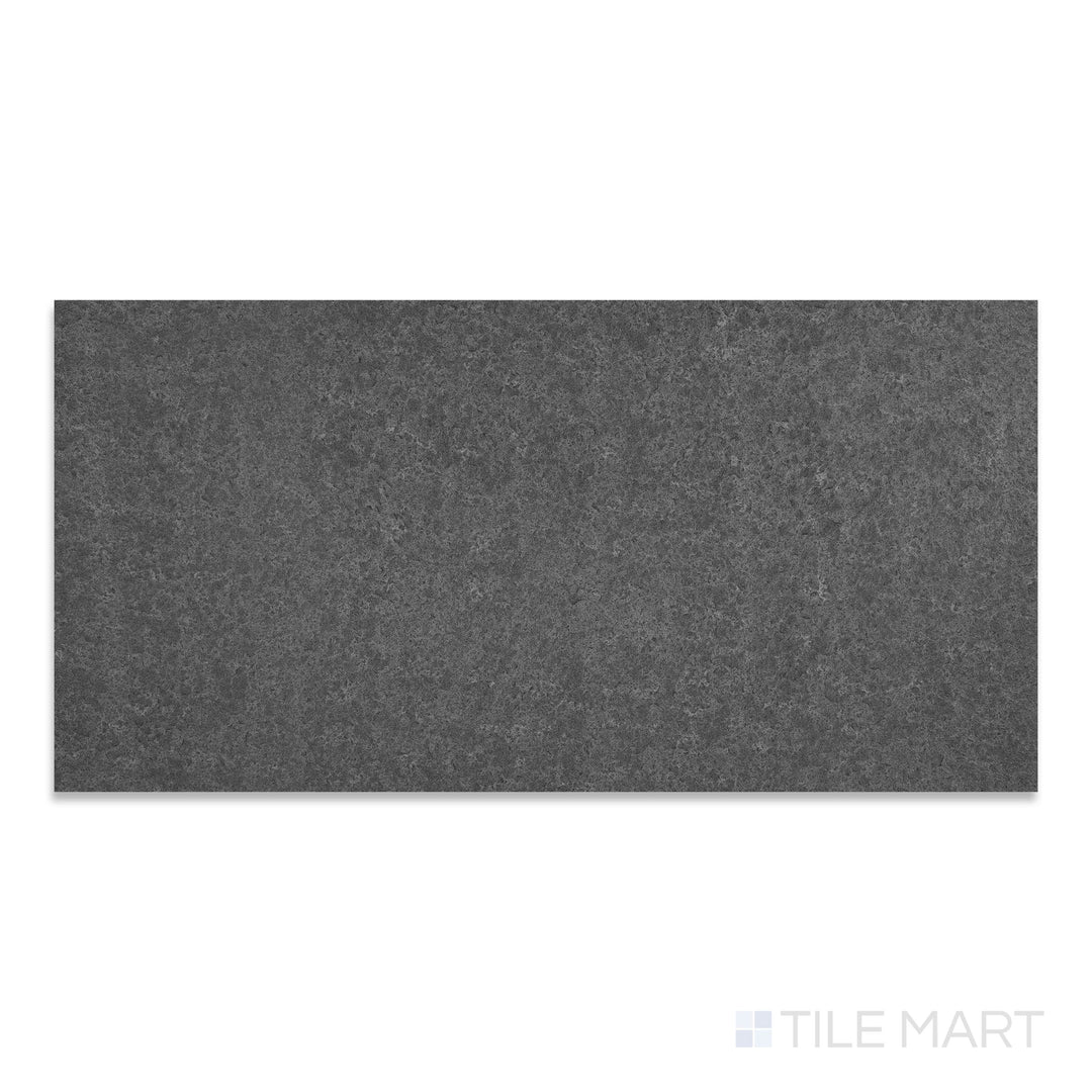 A precise close-up of Basalt Black 18X36 Flamed And Brushed, showcasing its unique flamed finish with a lightly brushed texture.