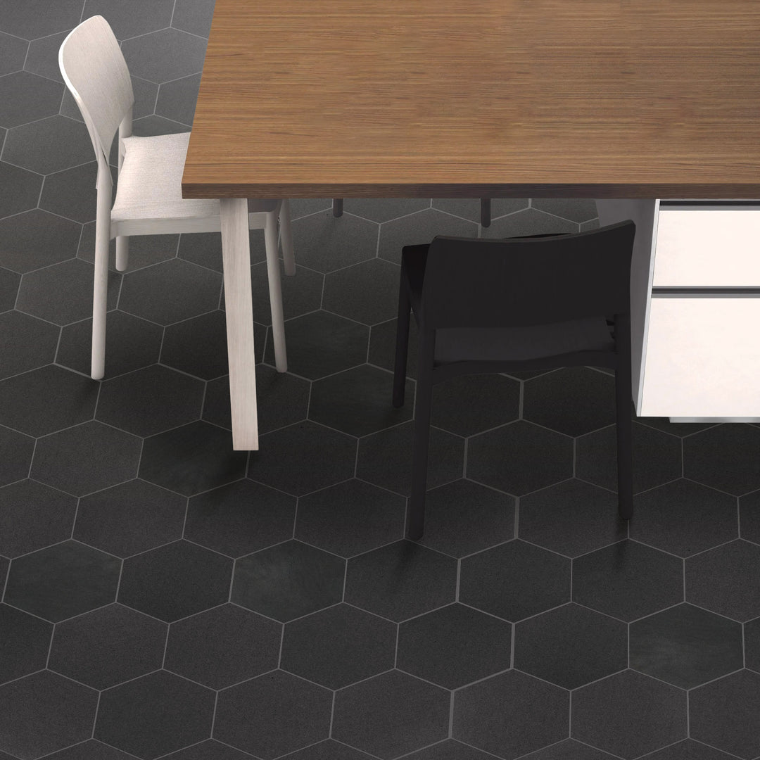 A contemporary-designed space utilizing Basalt Black 10" Hexagon Honed tiles, adding geometric elegance and a timeless aesthetic to the room’s foundation.