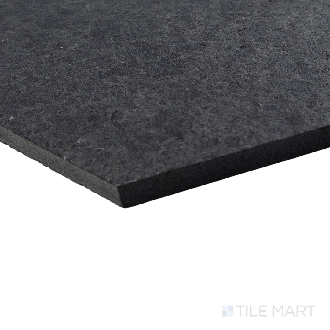 Basalt Black 10-inch hexagon tile shown at corner angle with flamed and brushed texture and bold shape