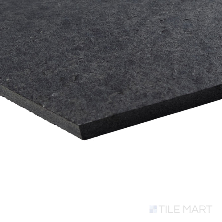 Basalt Black 10-inch hexagon tile shown at corner angle with flamed and brushed texture and bold shape