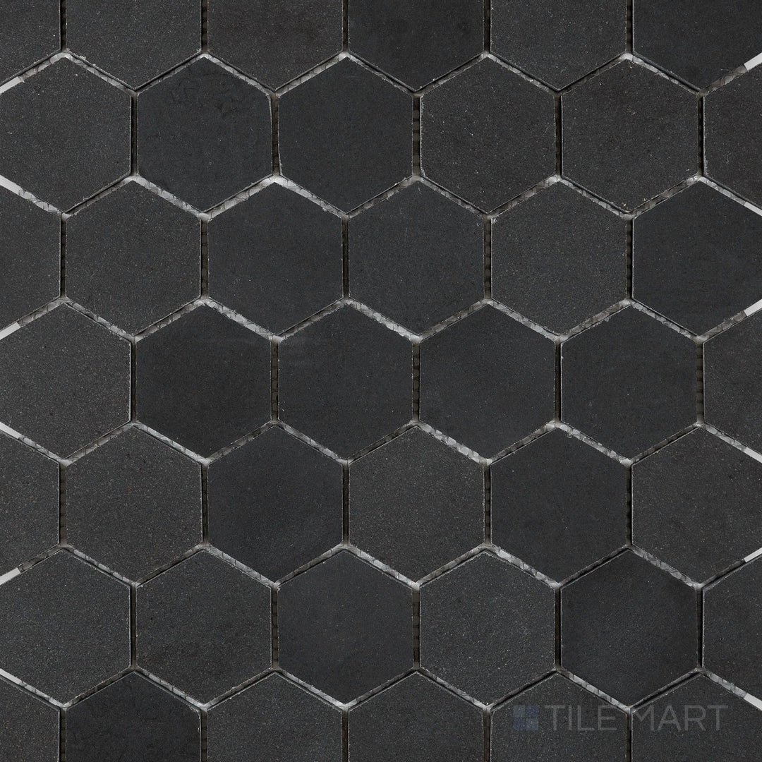 Overhead image of Basalt Black 2" hexagon honed mosaic tile, displaying small, precisely cut hexagonal pieces with a refined matte surface.