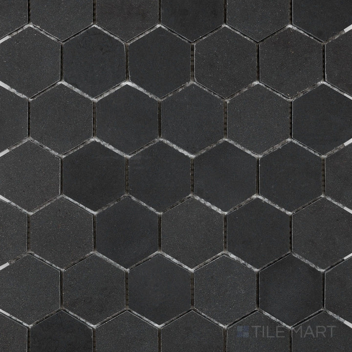 Overhead image of Basalt Black 2" hexagon honed mosaic tile, displaying small, precisely cut hexagonal pieces with a refined matte surface.