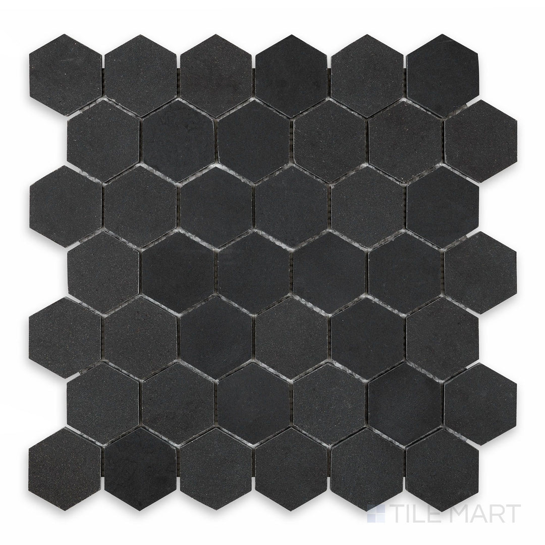 A close-up view of Basalt Black 2" Hexagon Honed Mosaic, highlighting its small hexagonal pattern with a refined honed finish.