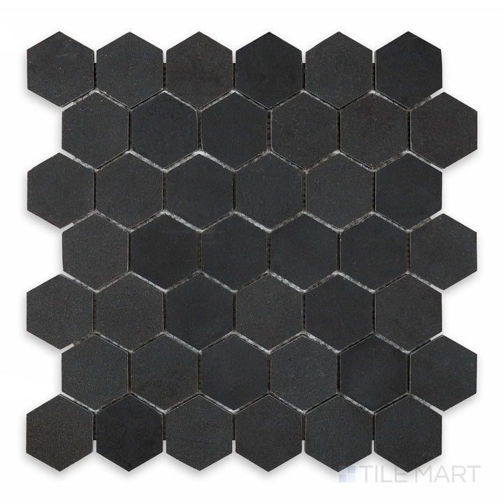 A close-up view of Basalt Black 2" Hexagon Honed Mosaic, highlighting its small hexagonal pattern with a refined honed finish.
