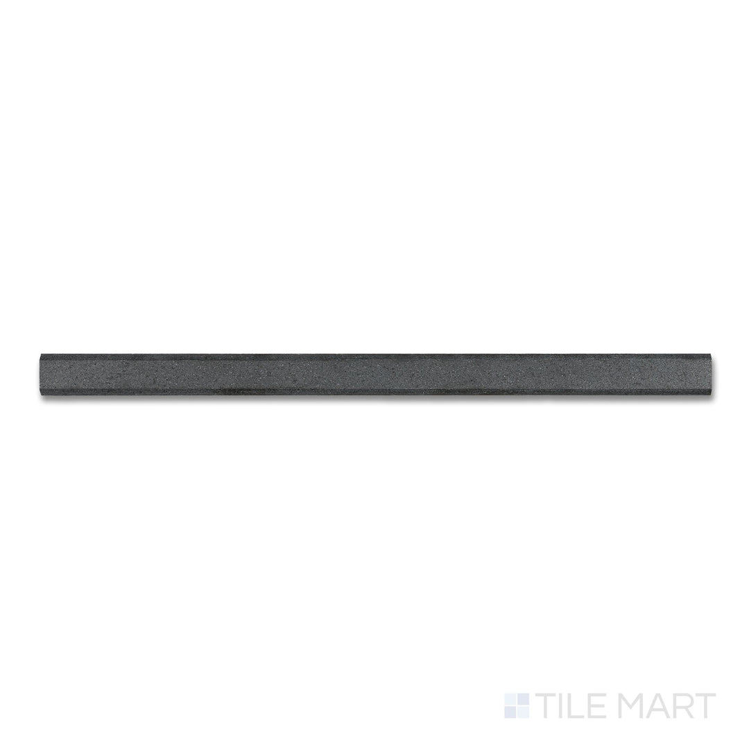 Top-down close-up of Basalt Black 0.75x12 honed modern liner, a narrow, smooth tile piece used for edging with a matte, refined surface.