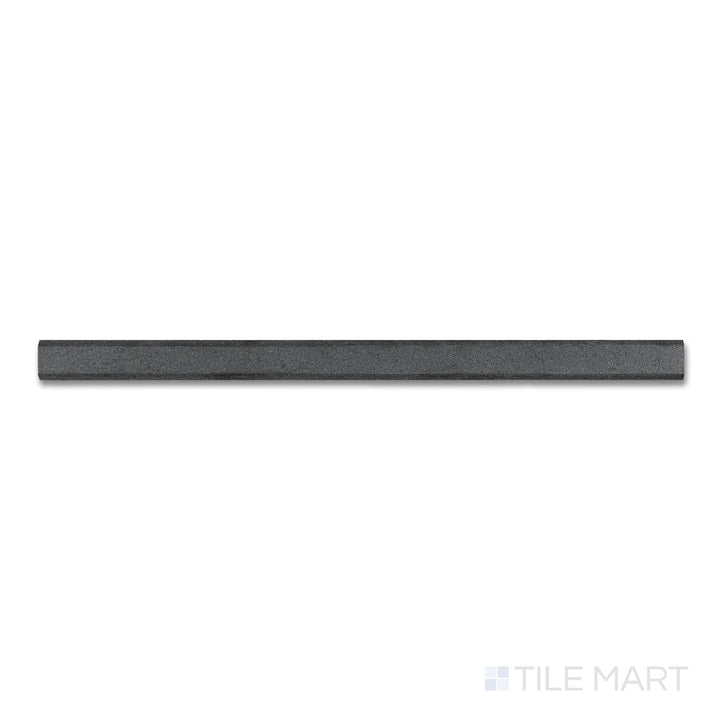 Top-down close-up of Basalt Black 0.75x12 honed modern liner, a narrow, smooth tile piece used for edging with a matte, refined surface.