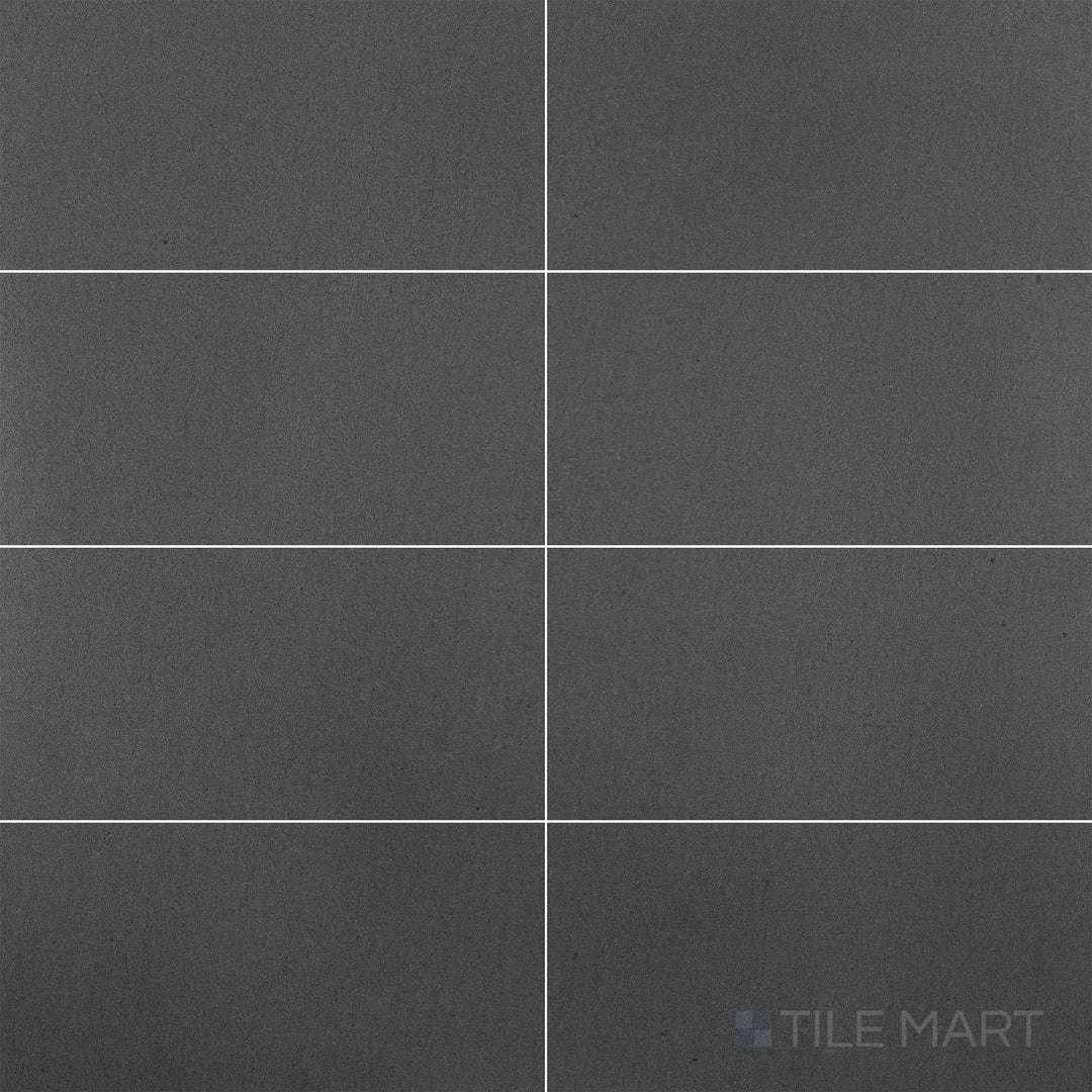 Flat-lay shot of Basalt Grey 12x24 honed tile, offering a subtle grey tone with a smooth honed finish for a sophisticated design.