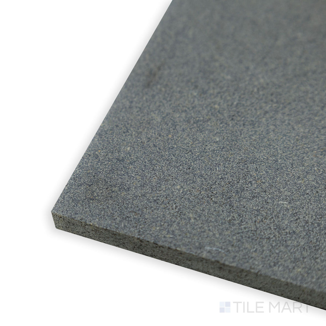 A close-up corner perspective of Basalt Grey 12x24 honed tile showcases its refined texture and neutral gray tone for a sophisticated, modern look.