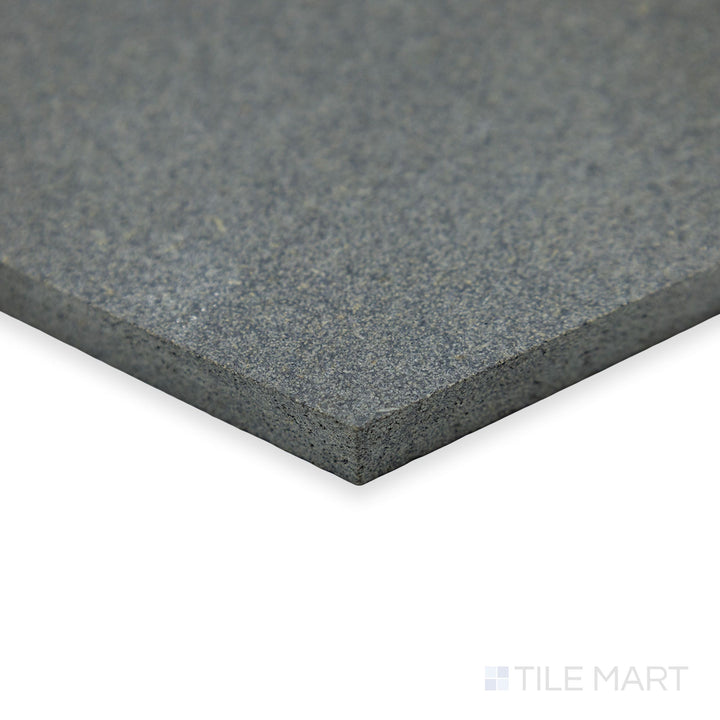 A stylish corner shot of Basalt Grey 10" hexagon honed tile highlights its geometric appeal and soft honed texture, blending elegance with natural stone beauty.