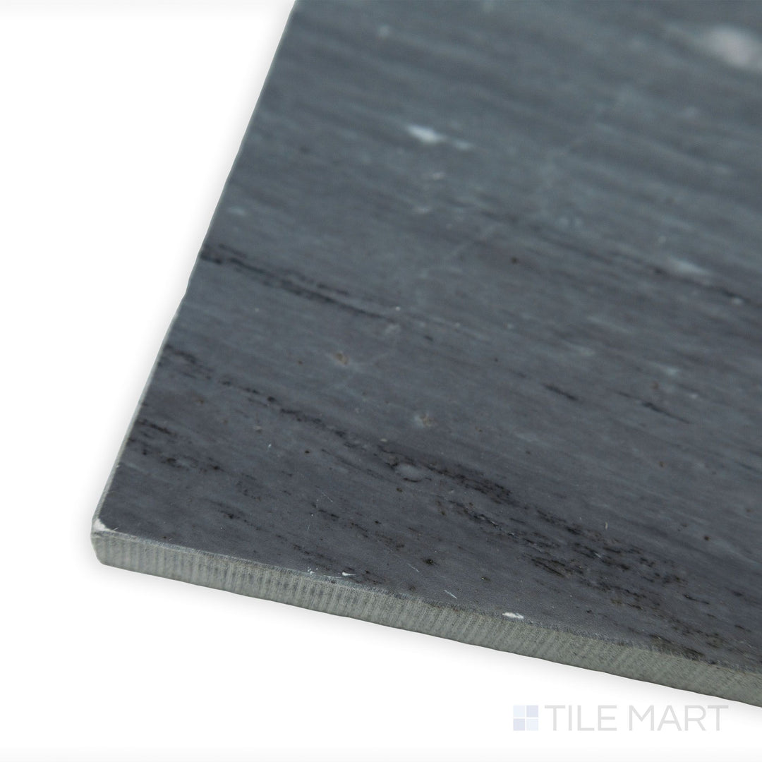 A corner shot of Bardiglio Imperiale Bluish Grey 4x12 honed marble tile, highlighting its soft matte finish and rich grey veining for a natural stone appeal.