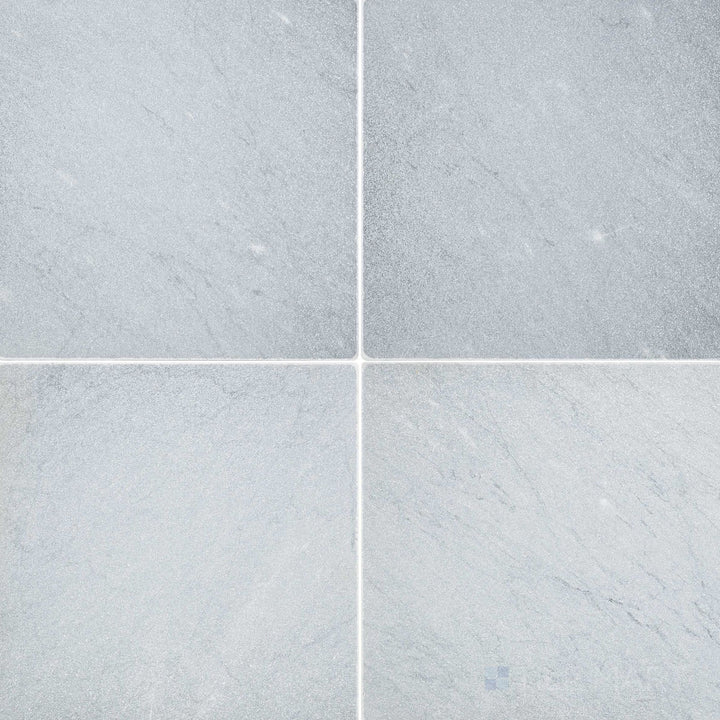 Overhead image of Bardiglio Imperiale Bluish Grey 12x12 tumbled marble tile, featuring a rustic tumbled texture with soft, natural edges.