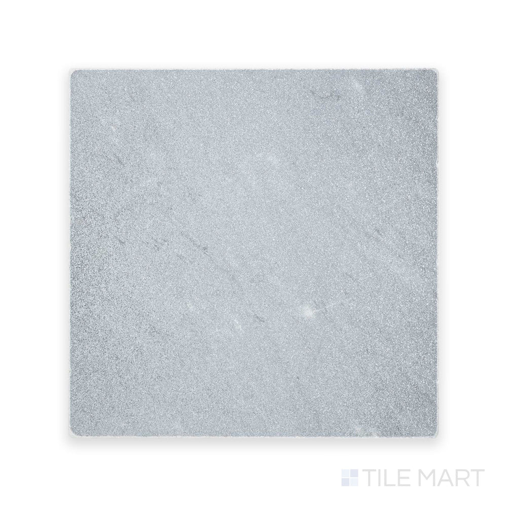 Zoomed-in perspective of Bardiglio Imperiale Bluish Grey 12X12 Tumbled Marble, featuring a gently weathered texture with soft edges.