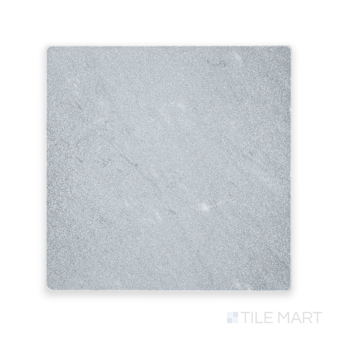 Zoomed-in perspective of Bardiglio Imperiale Bluish Grey 12X12 Tumbled Marble, featuring a gently weathered texture with soft edges.