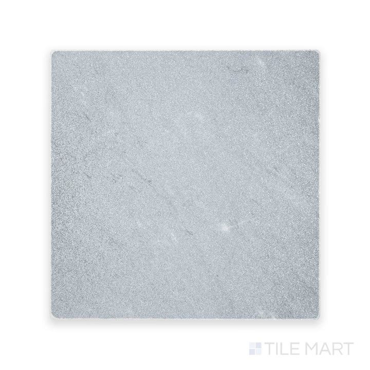 Zoomed-in perspective of Bardiglio Imperiale Bluish Grey 12X12 Tumbled Marble, featuring a gently weathered texture with soft edges.