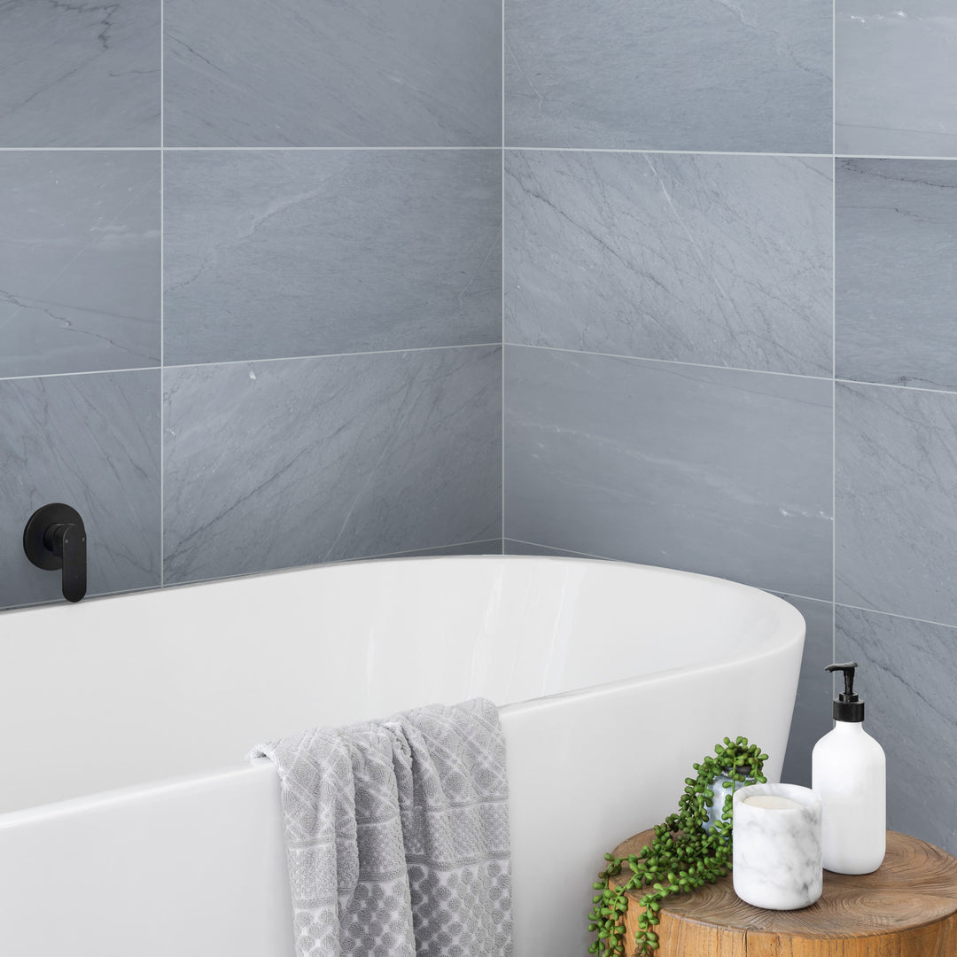 A luxurious modern roomscene featuring Bardiglio Imperiale Bluish Grey 12X24 Honed Marble, enhancing the space with its rich veining and soft matte finish.