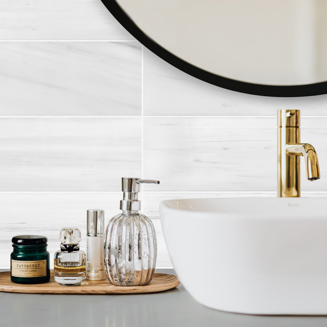 Bianco Dolomite marble 6x12 tile in honed finish styled in a clean, contemporary space