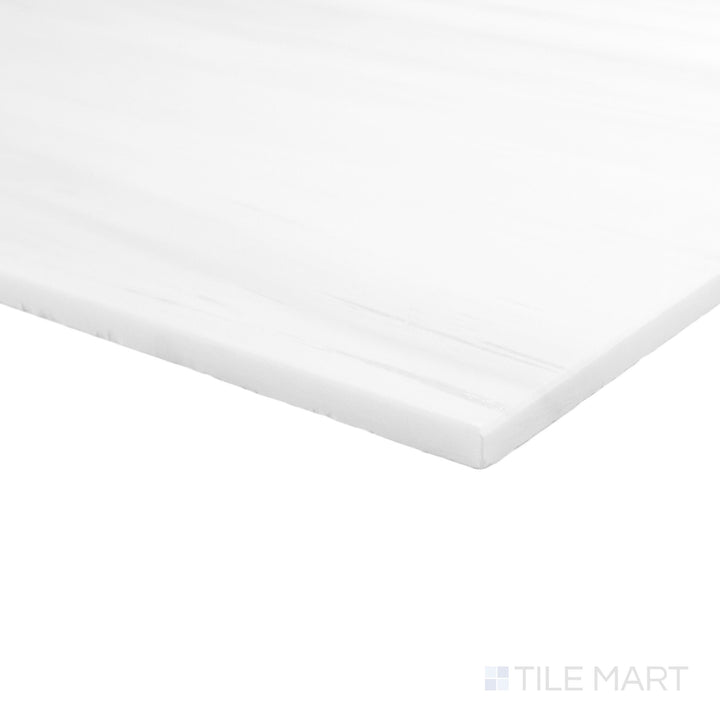 Honed Bianco Dolomite marble 6x12 tile shown at corner angle with smooth edges and natural movement