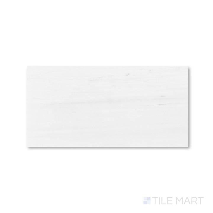 Top view of honed Bianco Dolomite marble 12x24 tile revealing linear scale and organic movement