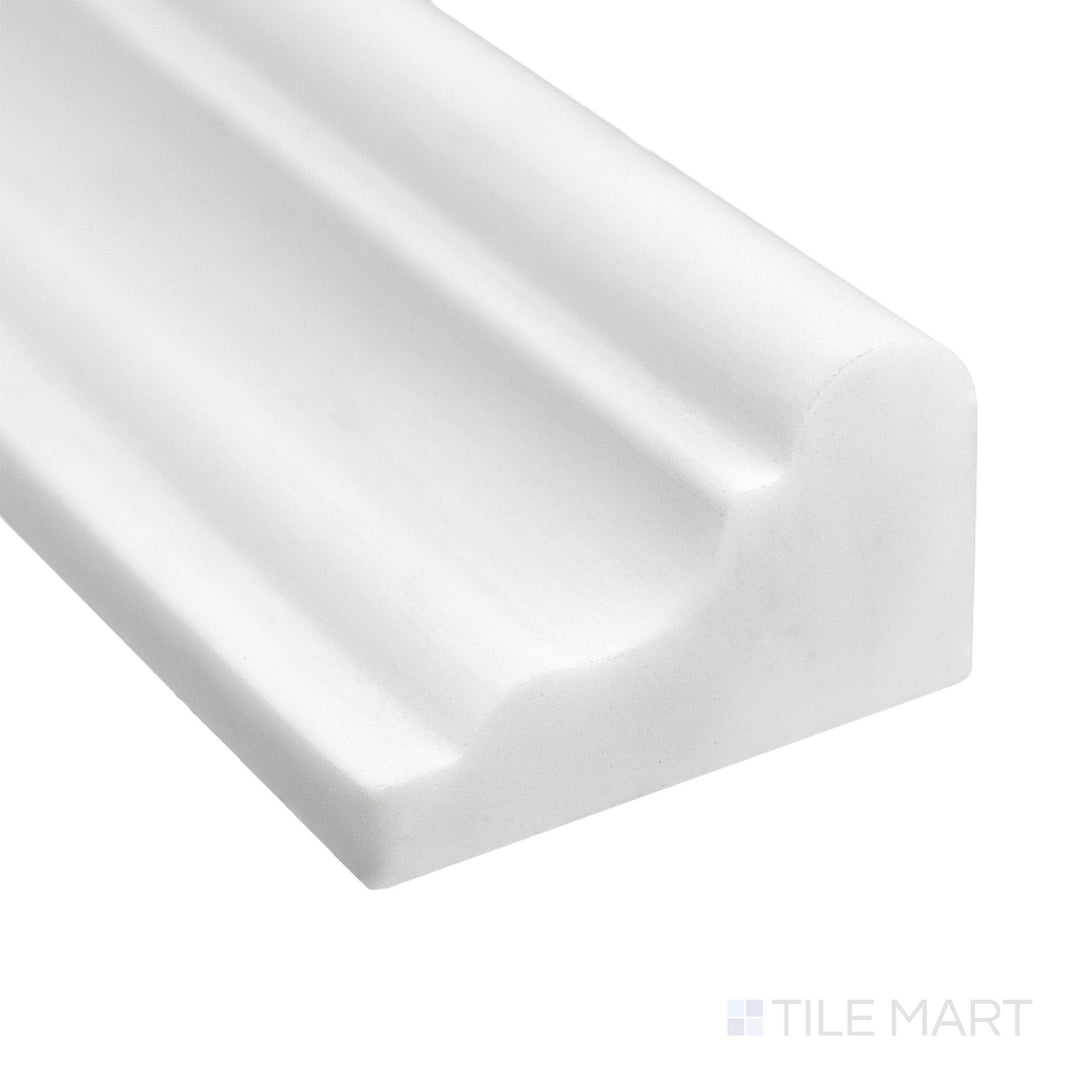 Corner close-up of Bianco Dolomite Marble 2x12 honed grand chair rail showing soft white tone and smooth matte edge.