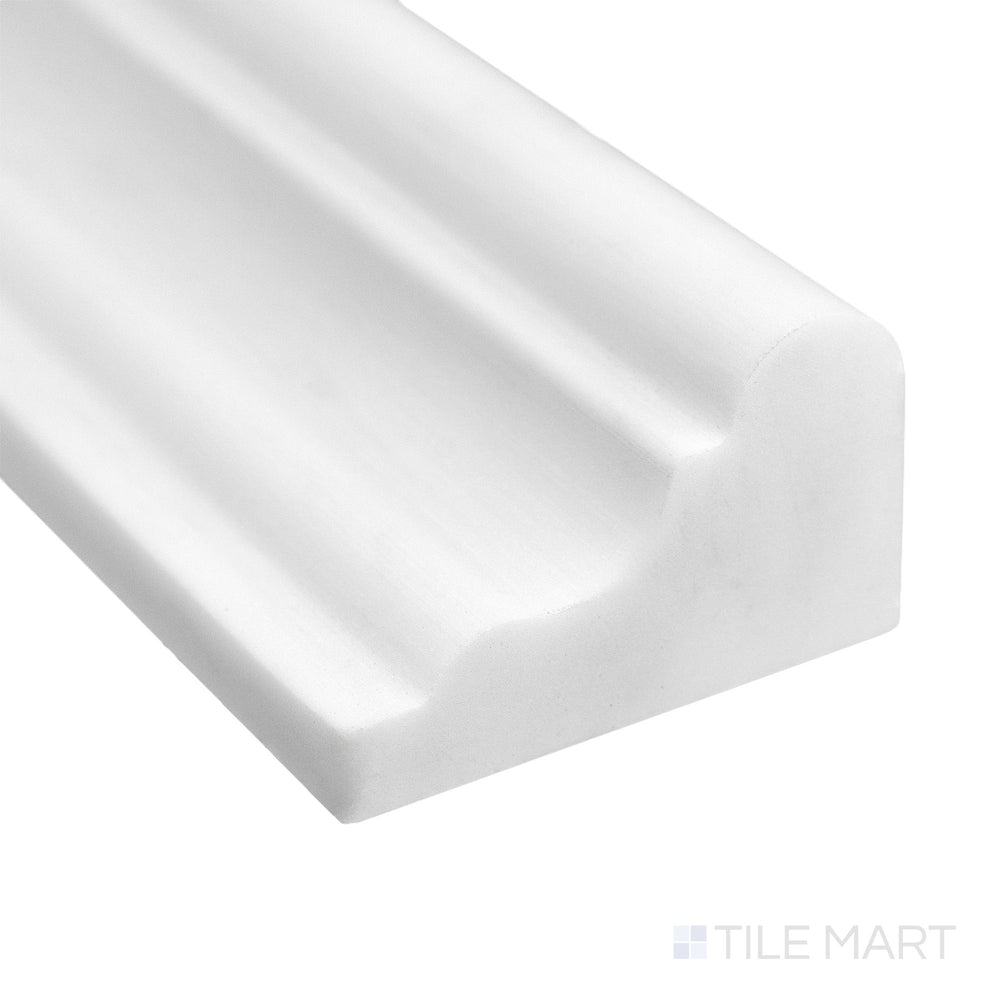 Corner close-up of Bianco Dolomite Marble 2x12 honed grand chair rail showing soft white tone and smooth matte edge.