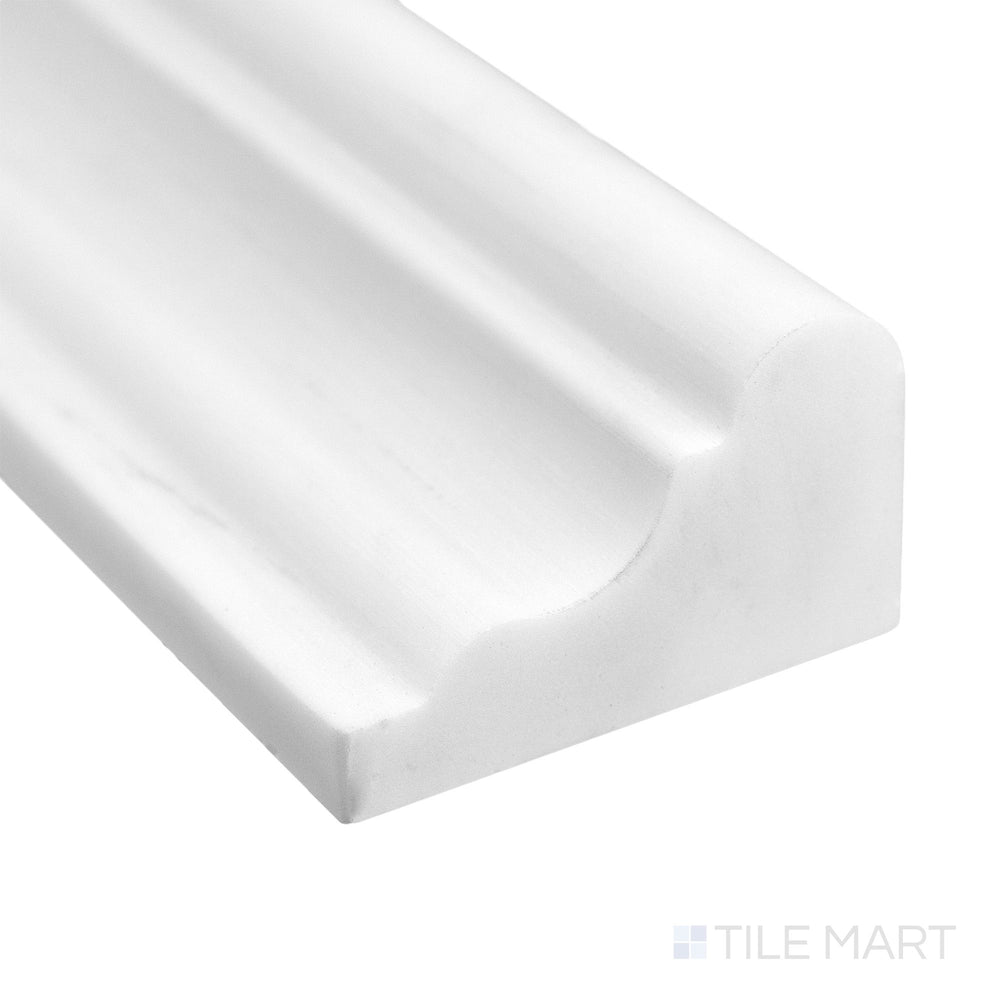 Corner detail of Bianco Dolomite Marble 2x12 honed grand chair rail highlighting refined profile and subtle veining.
