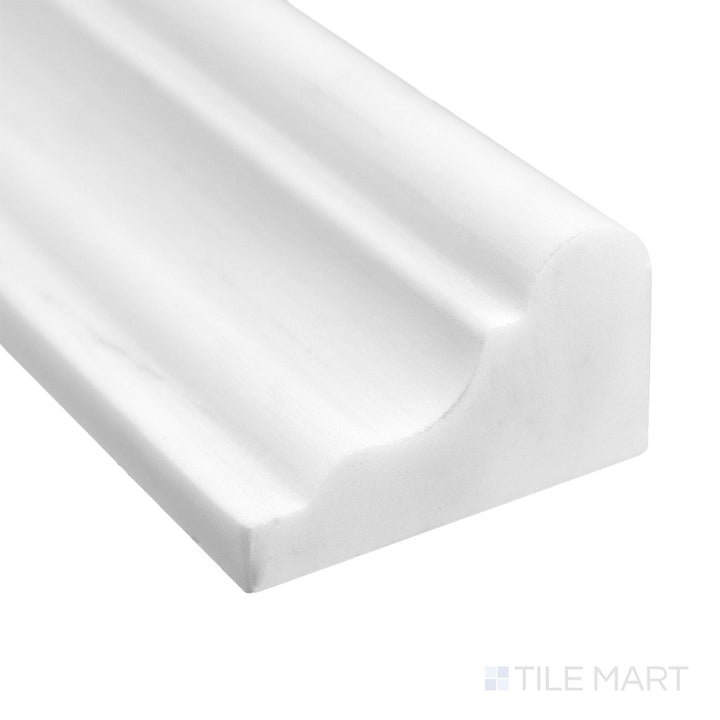 Corner detail of Bianco Dolomite Marble 2x12 honed grand chair rail highlighting refined profile and subtle veining.