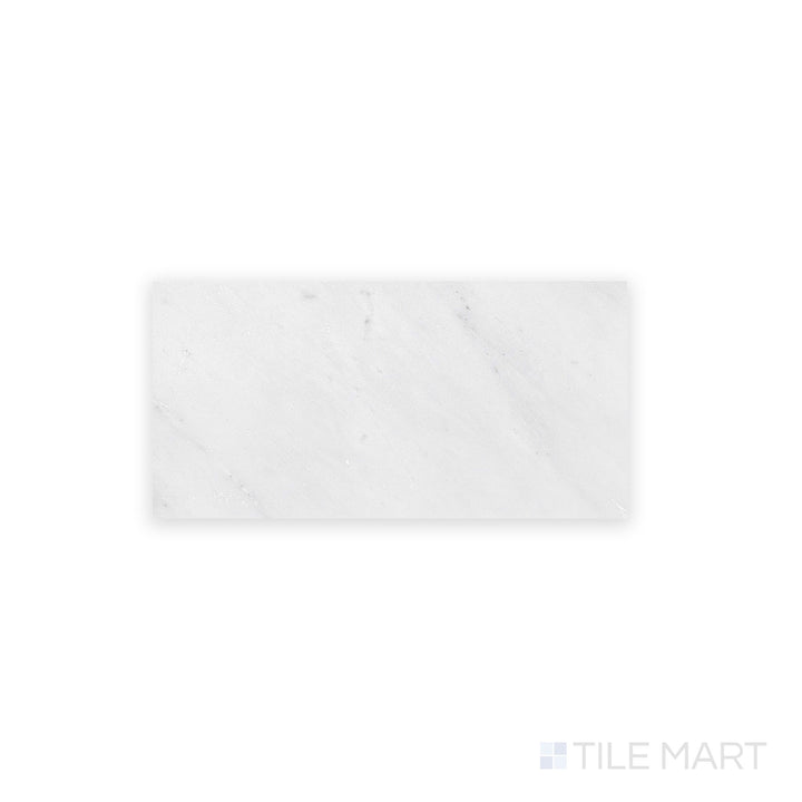 A close-up view of Oriental White Marble 3X6 Honed, featuring a soft matte surface with subtle veining in shades of grey.