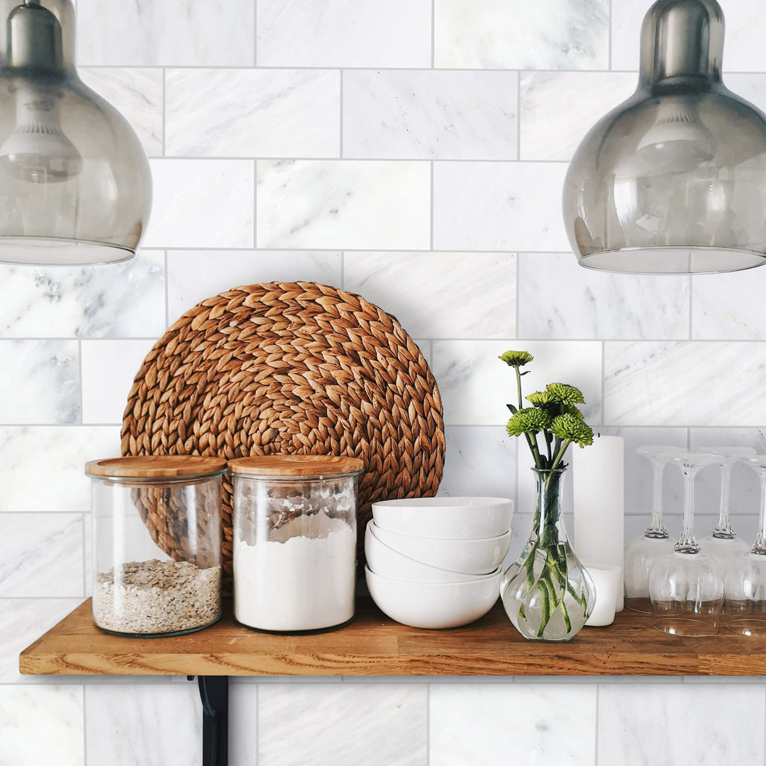 A well-designed kitchen or bath interior incorporating Oriental White Marble 3X6 Honed, highlighting the beauty of classic marble in a small-format subway pattern.