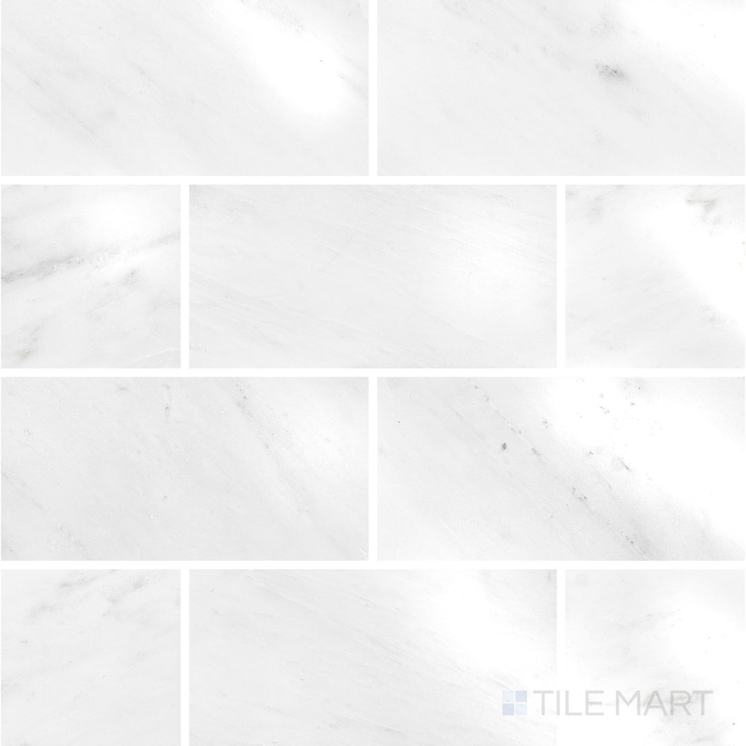Overhead image of Oriental White Marble 3x6 polished tile, showcasing a sleek, glossy surface that enhances the marble’s elegant veining.