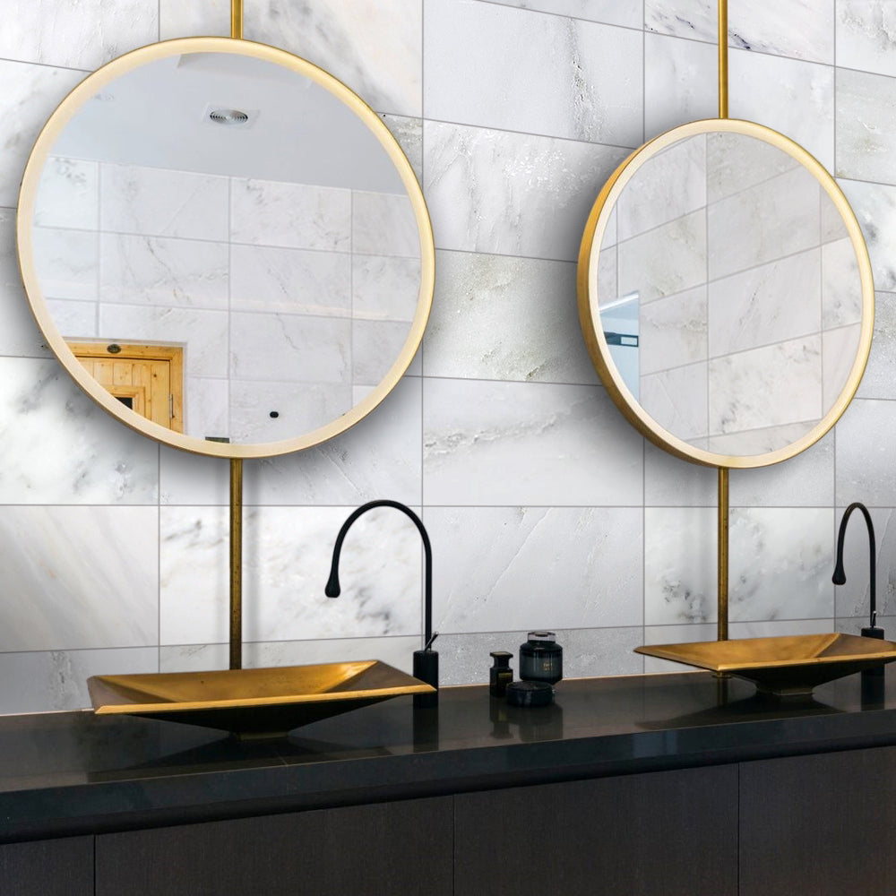 A grand and sophisticated space integrating Oriental White Marble 6X12 Honed, creating a seamless and elegant flow with its natural variations and soft white tones.