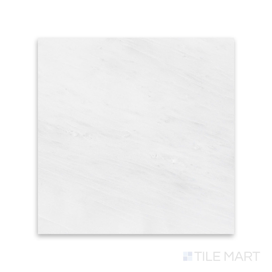 A smooth close-up of Oriental White Marble 12X12 Honed, presenting its matte appeal and authentic stone character.