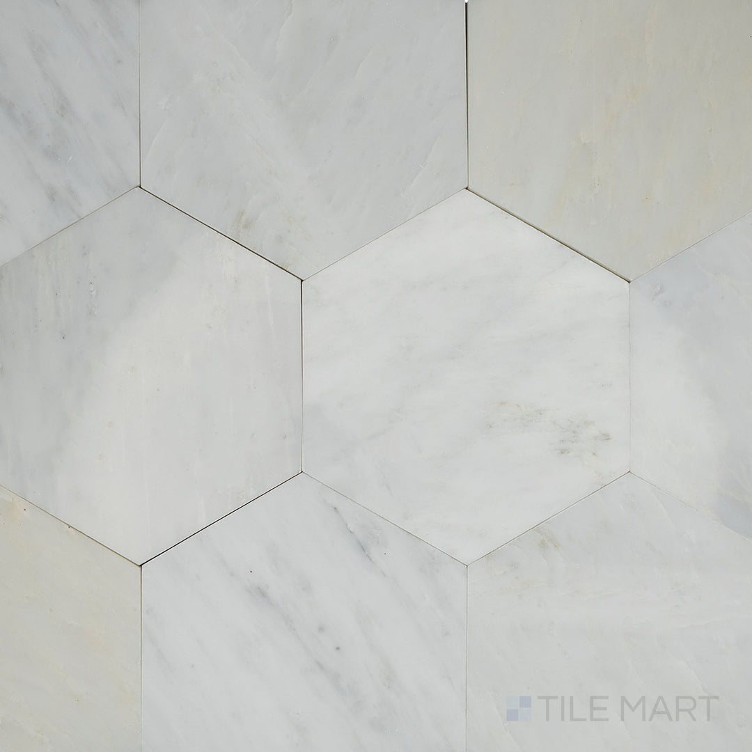 Top-down view of Oriental White Marble 6" hexagon honed tile, featuring a geometric hexagonal pattern with a smooth matte finish.