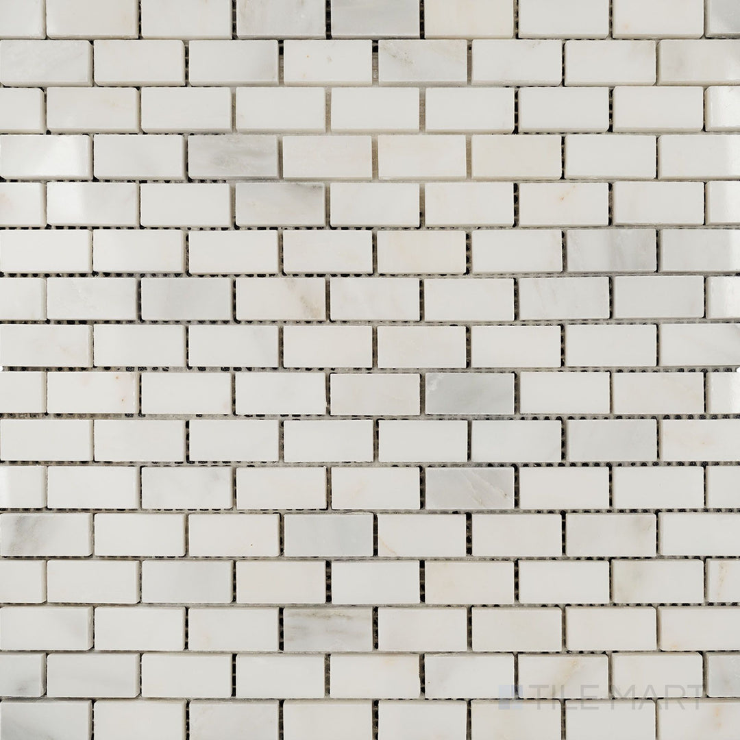 Top-down view of Oriental White Marble 5/8x1-1/4 brick polished mosaic, featuring a glossy brick pattern that enhances its refined look.