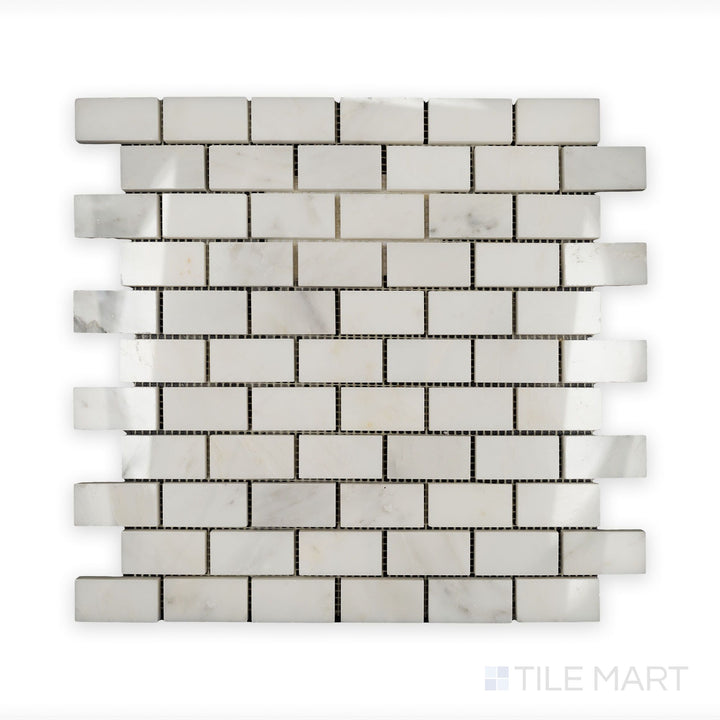 A sharp close-up of Oriental White Marble 1X2 Brick Polished Mosaic, displaying its smooth, glossy texture and crisp edges.