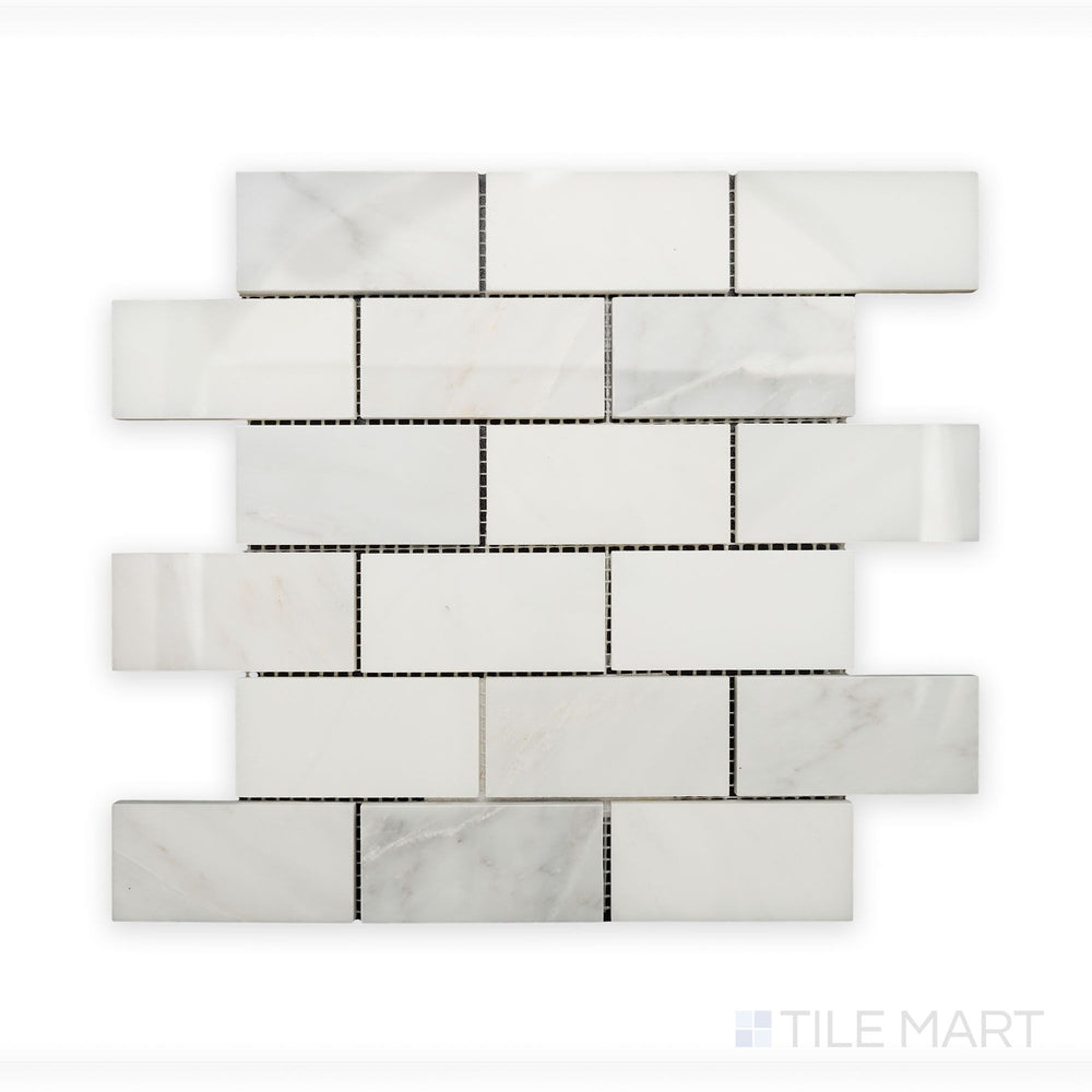 Zoomed-in detail of Oriental White Marble 2X4 Brick Polished Mosaic, highlighting its smooth, reflective surface and structured layout.