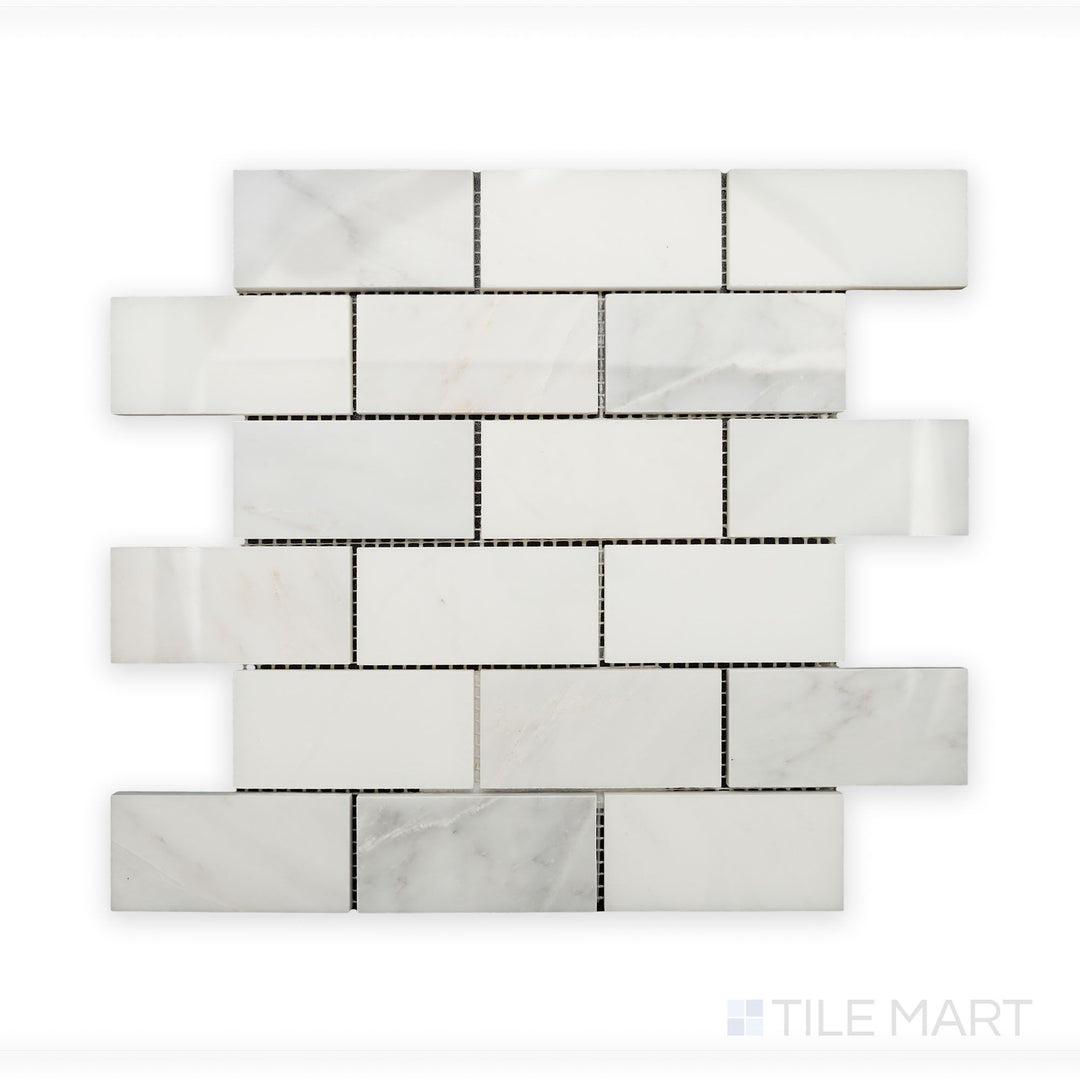 Zoomed-in detail of Oriental White Marble 2X4 Brick Polished Mosaic, highlighting its smooth, reflective surface and structured layout.