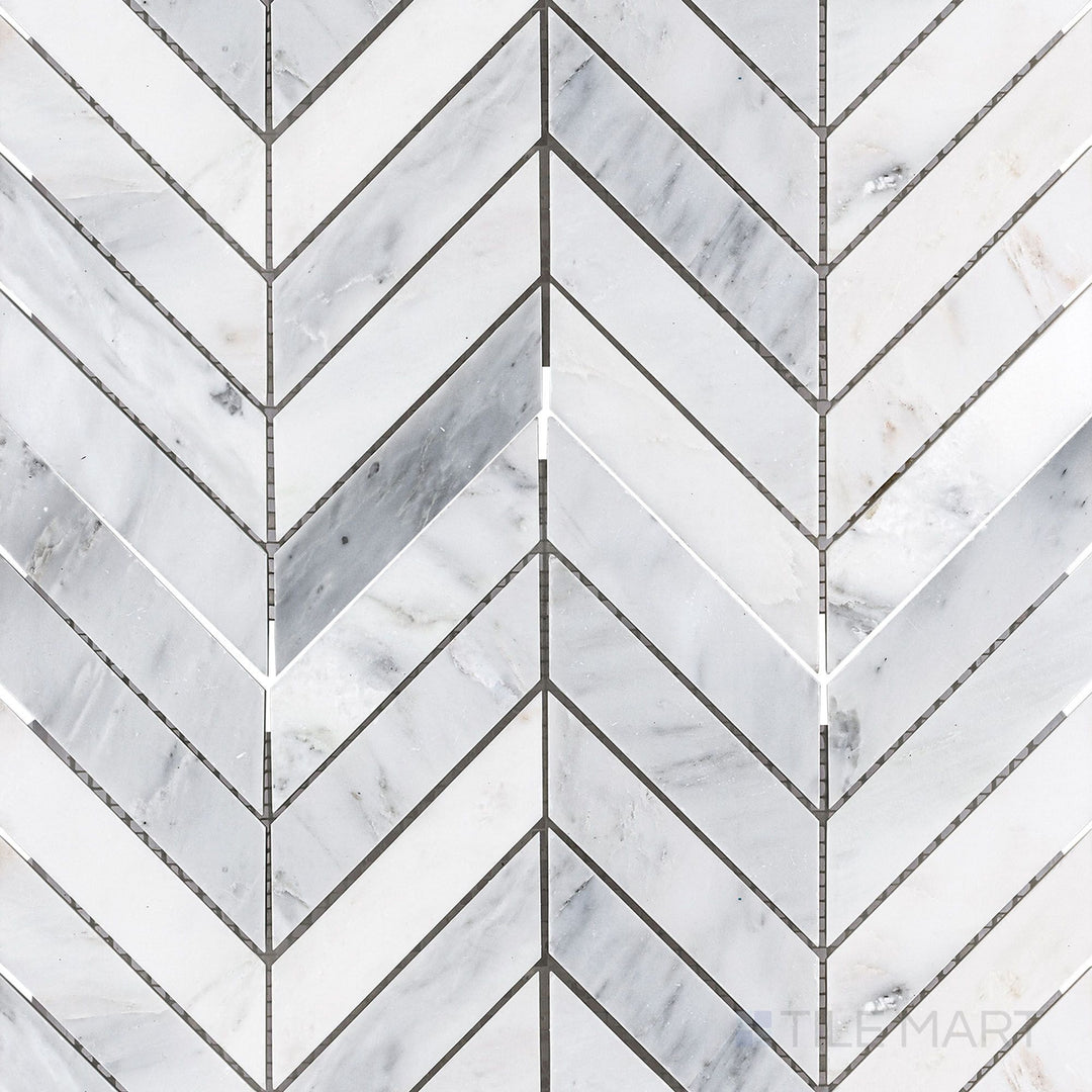Flat-lay shot of Oriental White Marble 1x4 chevron honed mosaic, showcasing a dynamic chevron pattern with a refined matte texture.