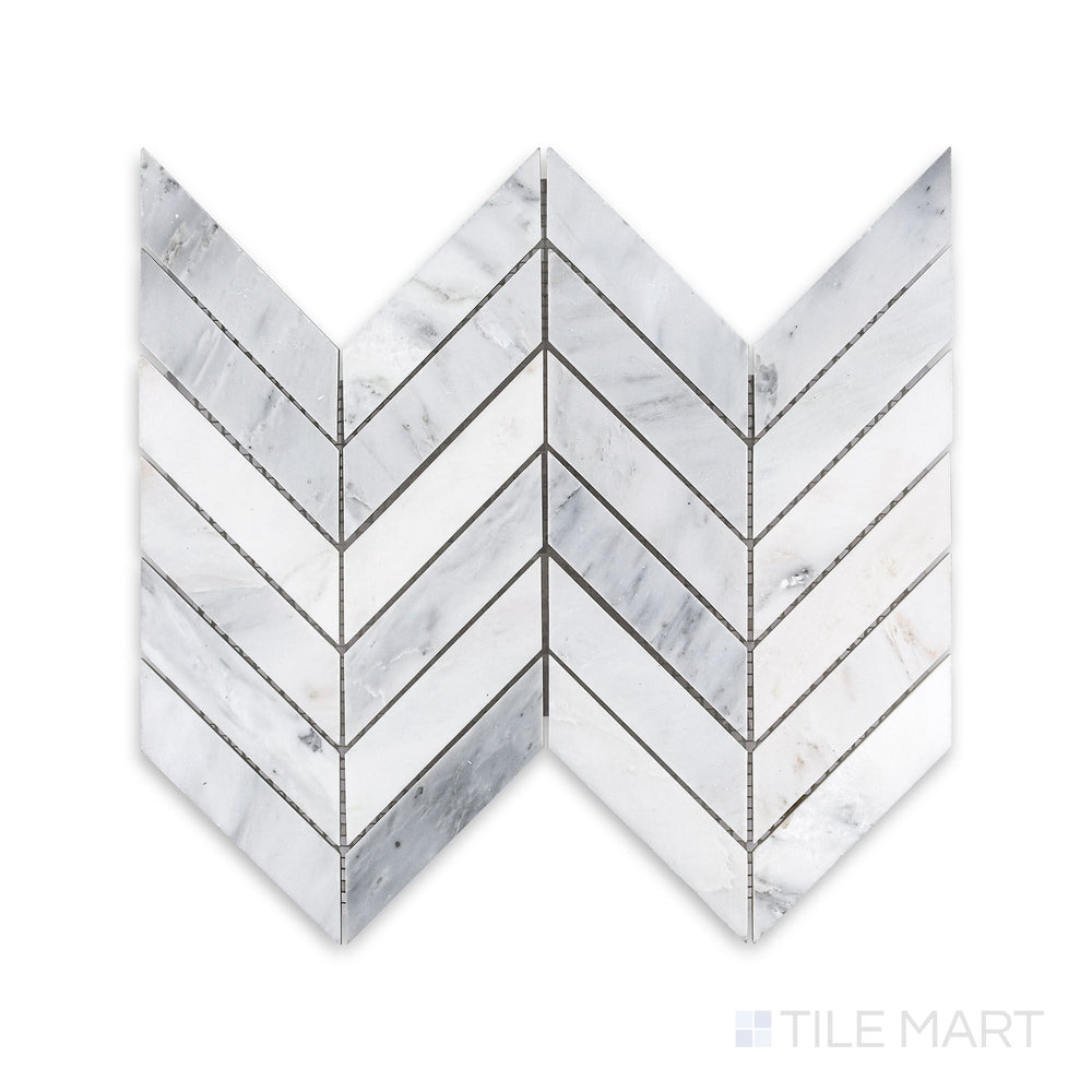 A finely detailed look at Oriental White Marble 1X4 Chevron Honed Mosaic, showcasing the striking V-shaped pattern with a subtle honed texture.