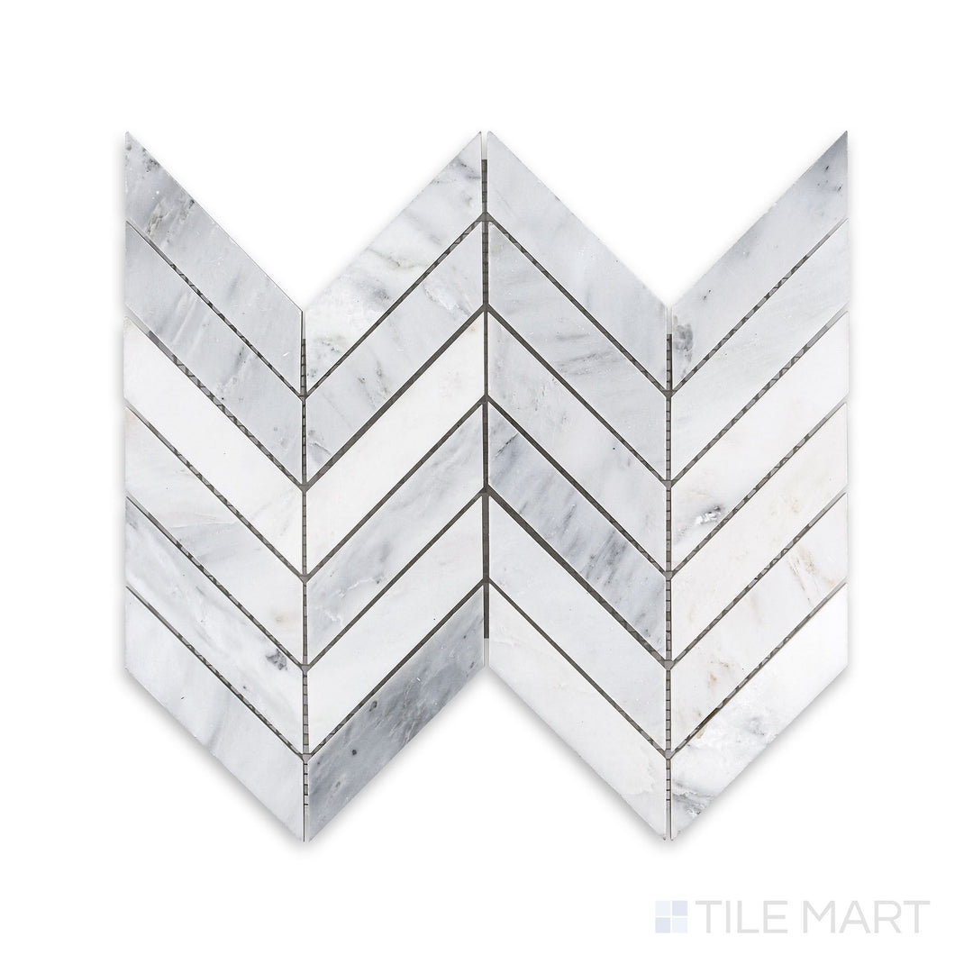 A finely detailed look at Oriental White Marble 1X4 Chevron Honed Mosaic, showcasing the striking V-shaped pattern with a subtle honed texture.