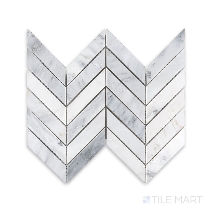 A finely detailed look at Oriental White Marble 1X4 Chevron Honed Mosaic, showcasing the striking V-shaped pattern with a subtle honed texture.