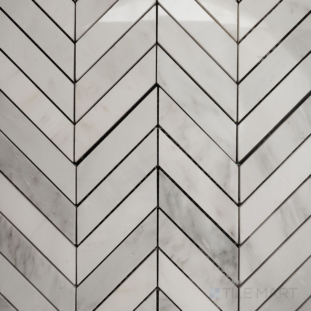 Top-down view of Oriental White Marble 1x4 chevron polished mosaic, featuring a striking chevron pattern with a glossy, elegant finish.