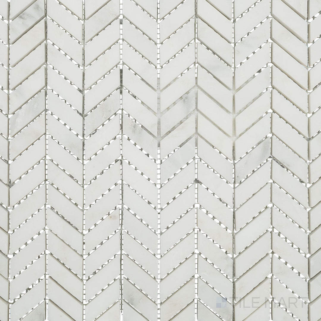 Overhead image of Oriental White Marble mini chevron honed mosaic, displaying a compact chevron design with a soft honed texture.