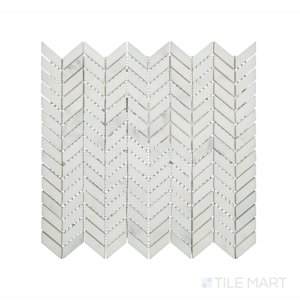 A sharp close-up of Oriental White Marble Mini Chevron Honed Mosaic, emphasizing its refined texture and precise geometric arrangement.