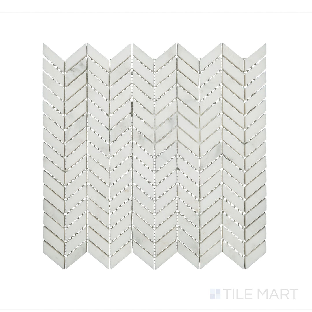 A sharp close-up of Oriental White Marble Mini Chevron Honed Mosaic, emphasizing its refined texture and precise geometric arrangement.