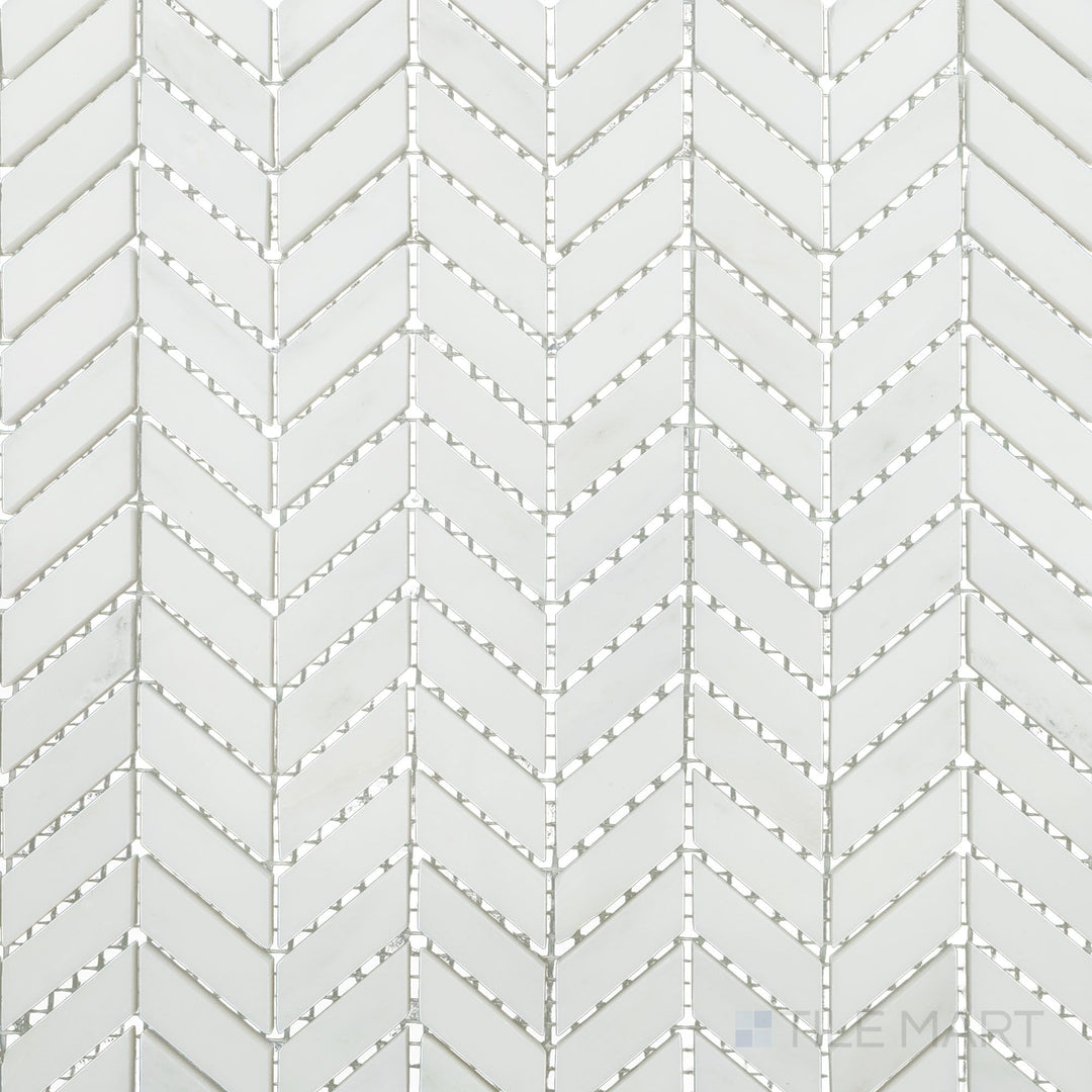 Flat-lay shot of Oriental White Marble mini chevron polished mosaic, featuring a sleek polished surface that highlights its intricate pattern.