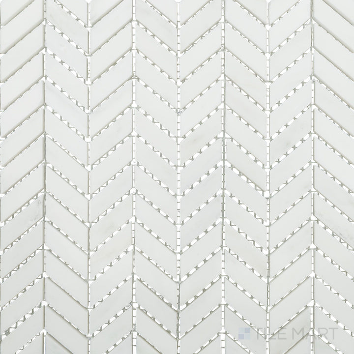 Flat-lay shot of Oriental White Marble mini chevron polished mosaic, featuring a sleek polished surface that highlights its intricate pattern.